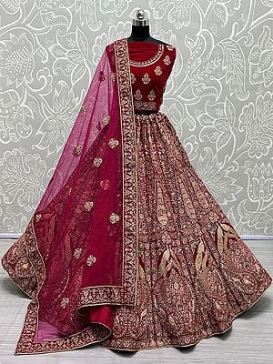 Rani-Pink Velvet Mughal-Peacock Motif Bridal Lehenga Choli With Dori, Thread, Zircon-Diamond Embroidery And Soft Net Butti Pattern Dupatta