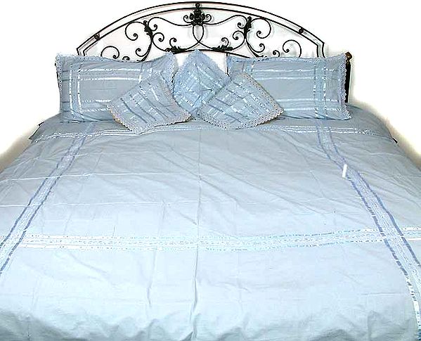 Pale Blue Bedspread with Cushions