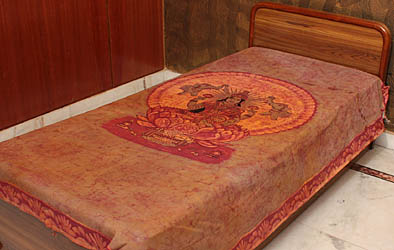 Gajalakshmi on an Single-Bed Bedspread