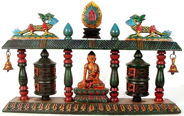 The Buddha Flanked by Prayer Wheels