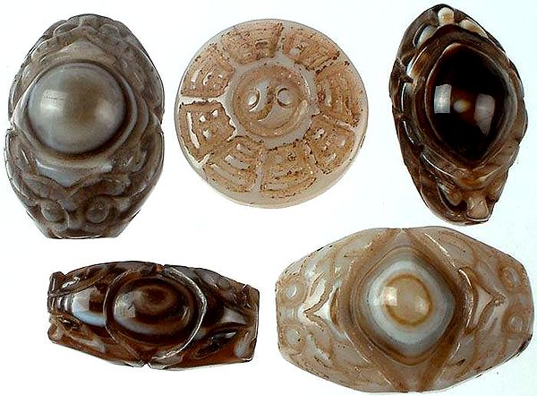 Lot of Five Carved Onyx Evil Eye and Yin Yang
