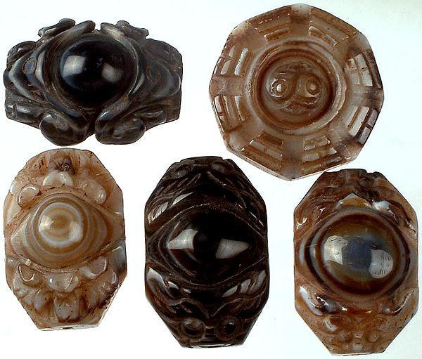 Lot of Five Carved Onyx Eyes with Yin Yang