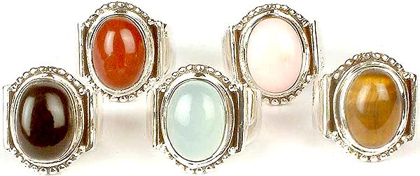 Lot of Five Oval Gemstone Rings<br>(Carnelian, Pink Opal, Black Onyx, Blue Chalcedony & Tiger Eye)