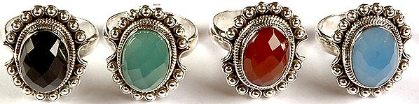 Lot of Four Faceted Gemstone Rings (Black Onyx, Green Onyx, Carnelian and Blue Chalcedony)
