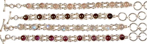 Lot of Four Gemstone Bracelets<br>(Rose Quartz, Black Onyx, Rainbow Moonstone & Amethyst)