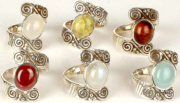 Lot of Six Gemstone Rings with Spirals<br>(Chalcedony, Canadian Jade, Iron Tiger Eye, Garnet, Rainbow Moonstone & Peru Chalcedony)