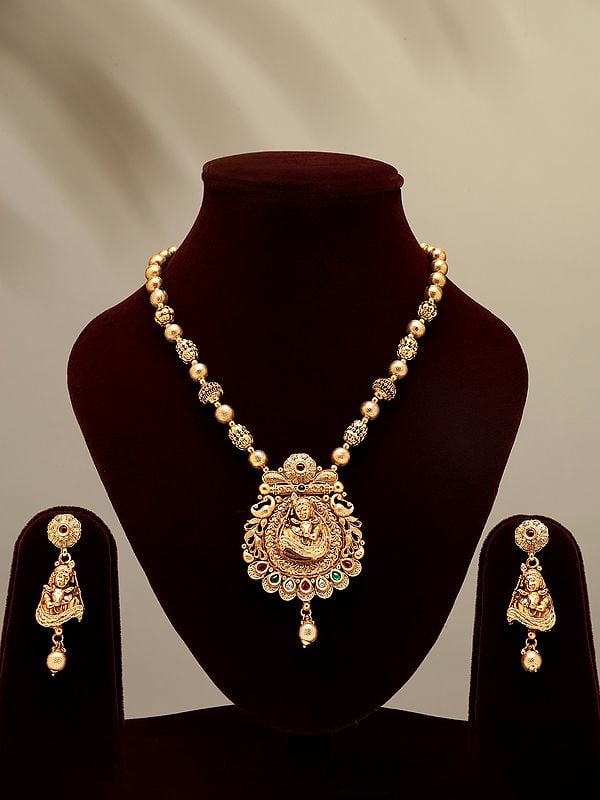 Stone Studded Bal Krishna with Cow Necklace and Earrings Set