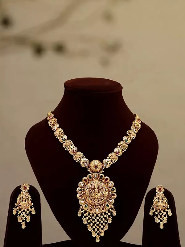 Stone Studded Goddess Lakshmi long Necklace Set with Earrings