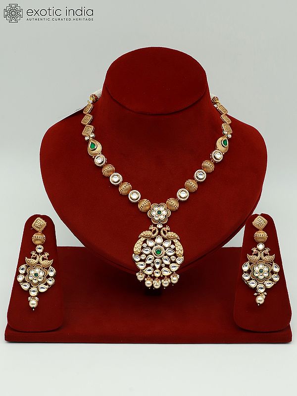Attractive Kundan Studded Necklace Set With Peacock Pendant And Earrings