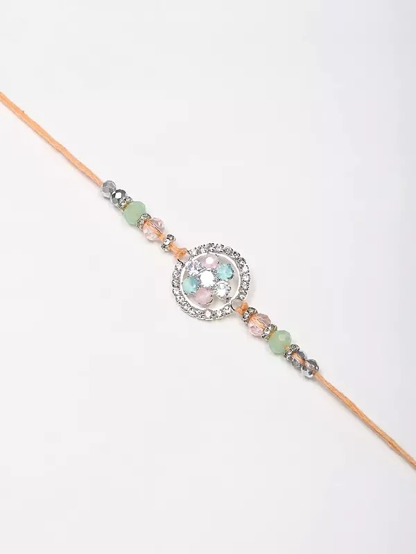 Scintillating Studded Stone Floral Round Rakhi with Raksha Sutra