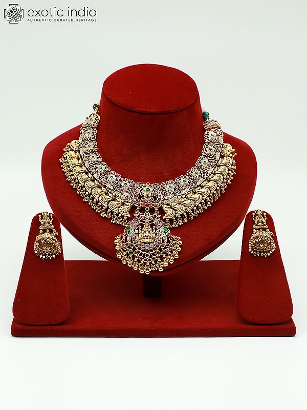 Traditional Goddess Lakshmi Stone Studded And Beaded Necklace With Earrings