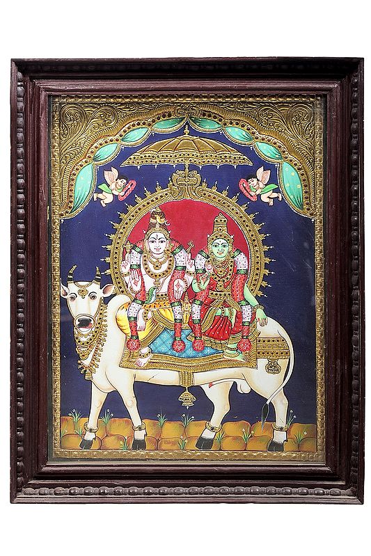 Lord Shiva with Parvati Seated on Nandi Tanjore Painting | Traditional Colors With 24K Gold | Teakwood Frame | Gold & Wood | Handmade | Made In India