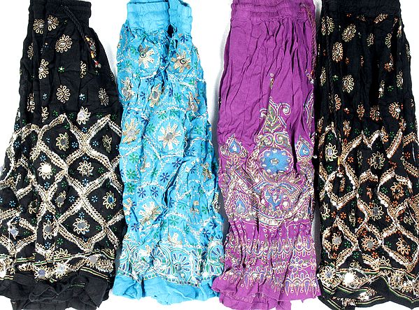 Lot of Four Skirts from Nepal with Painted Motifs and Sequins