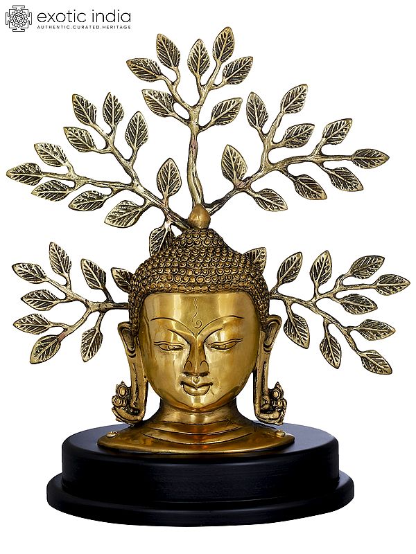 Lord Buddha Mask On a Wooden Base and Tree as a Backdrop