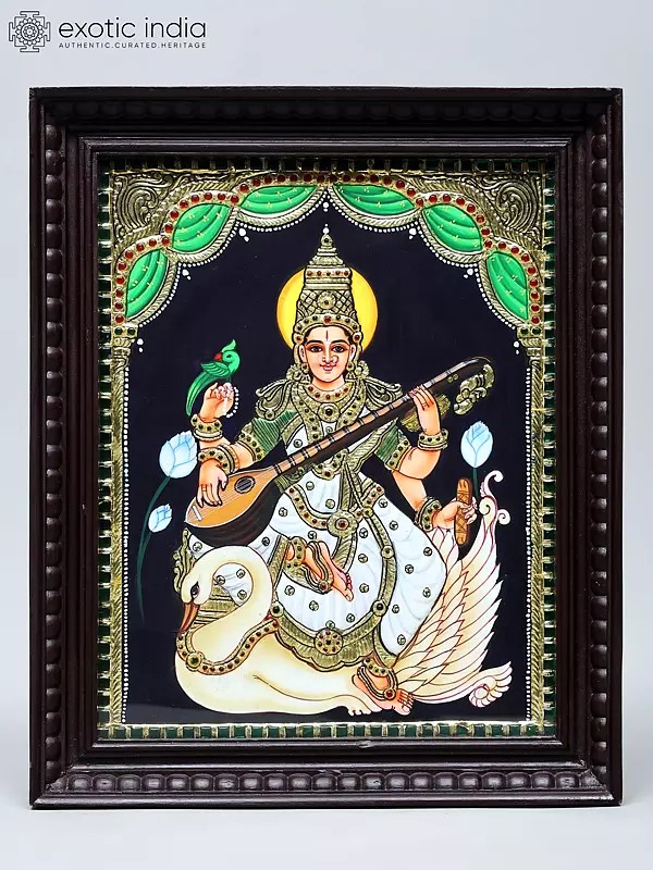 Four Armed Goddess Saraswati Seated on Swan | Handmade Tanjore Painting | Traditional Colors with 24 Karat Gold | With Frame