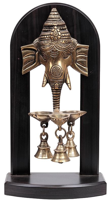 Lord Ganesha on Wooden Stand with Lamps and Bells