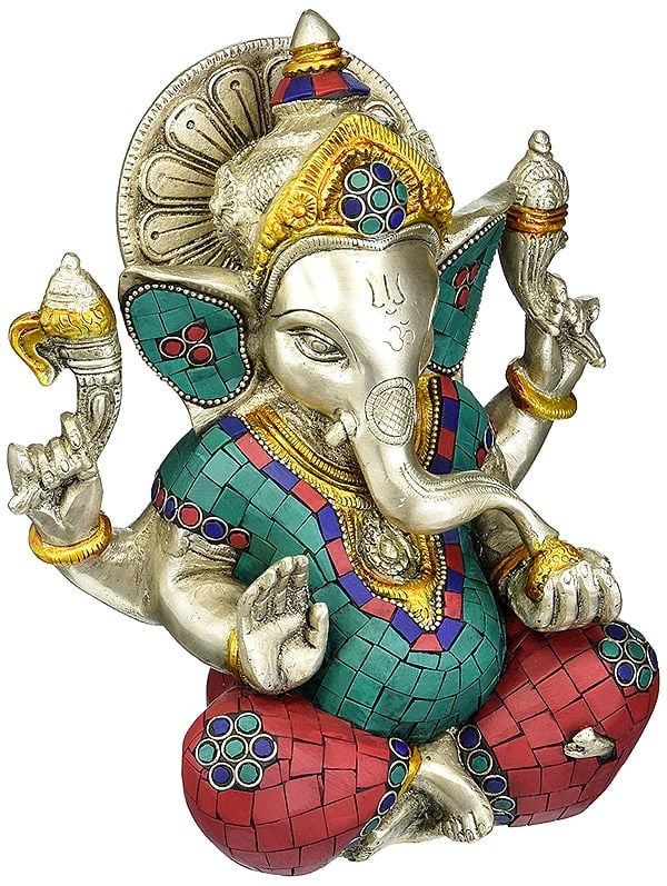 8" Seated Ganesha, The Silver Of His Halo In Striking Contrast To The Richly Hues Of The Inlay In Brass | Handmade | Made In India