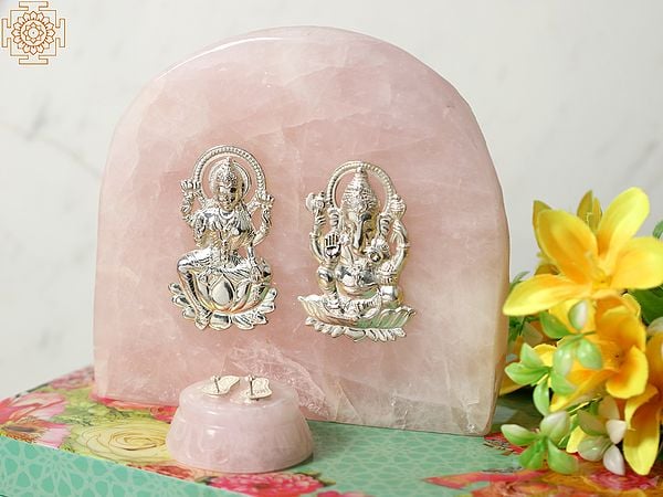 Silver Blessing Lakshmi Ganesha Idol on Rose Quartz Gemstone with Charan Paduka