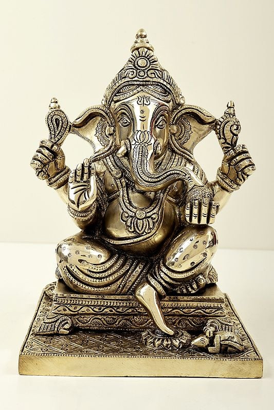 9" Lord Ganesha Seated on Pedestal and Eating Modak | Brass Bhagawan Ganesha | Brass Statue | Handmade | Made In India