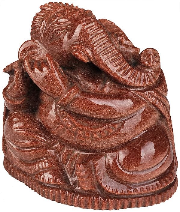 Lord Ganesha Playing Flute (Carved in Sunstone)