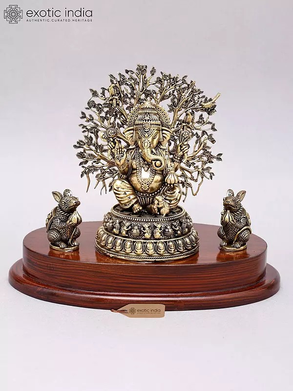 Lord Ganesha Brass Statue with Tree as Backdrop on Wooden Base