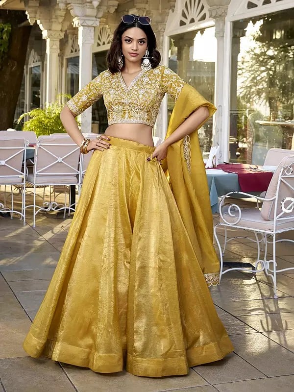 Saffron-Mango Vichitra Silk Solid Attractive Lehenga Choli With Sequins And Embroidered Matching Dupatta