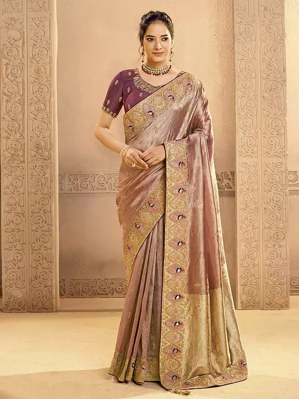 Elegant Metallic Zari Tissue Silk Saree Featuring Traditional Motifs And Detailed Cutdana Handwork For Special Occasions