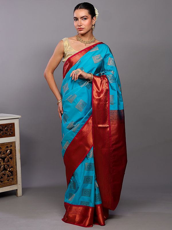 Scuba-Blue Kanjivaram Saree with Woven Peacocks Motifs in Copper Colored Thread and Contrast Border-Anchal from Bangalore