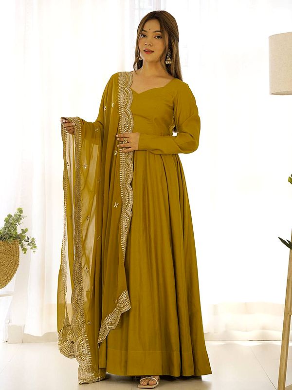 Attractive Fully Flared Solid Roman Silk Anarkali Suit With Embroidery Work Dupatta