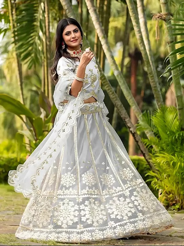 Charming Net Lehenga Choli With Dupatta Adorned With Foil Mirror And Exquisite Embroidery Work