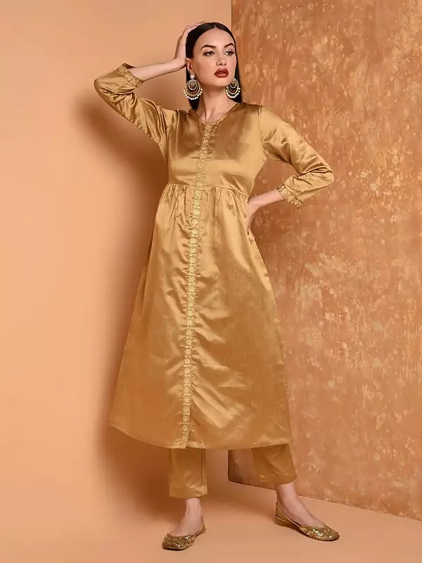 Women Elegant Beige Embroidered Flared Silk Kurta Set With Pants For Party Wear And Festive Occasions