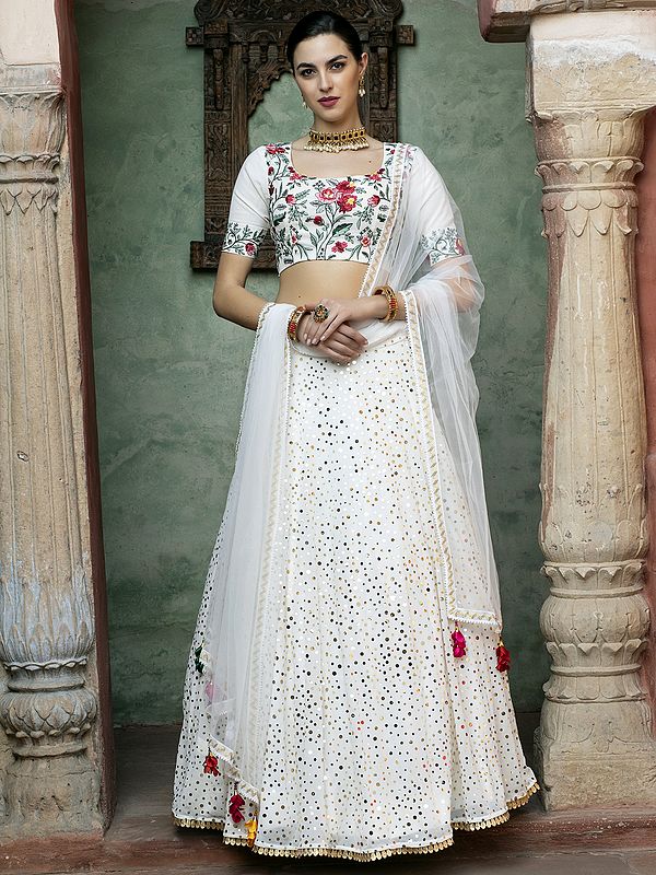 White Georgette Fancy Sequins Embroidered Lehenga With Floral Motif Choli And Net Tassel Dupatta