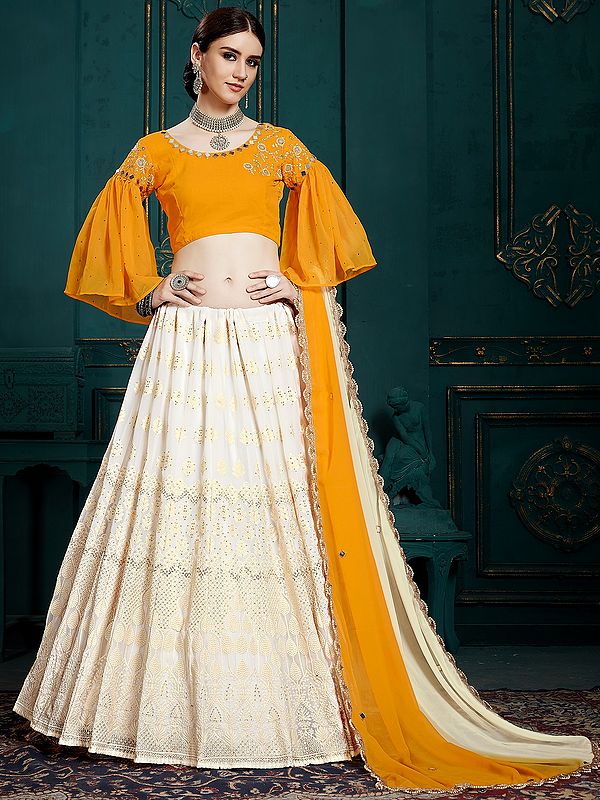 Cream and Yellow Lehenga with Bell Sleeves and Mirror Work on Choli and Scalloped Dupatta