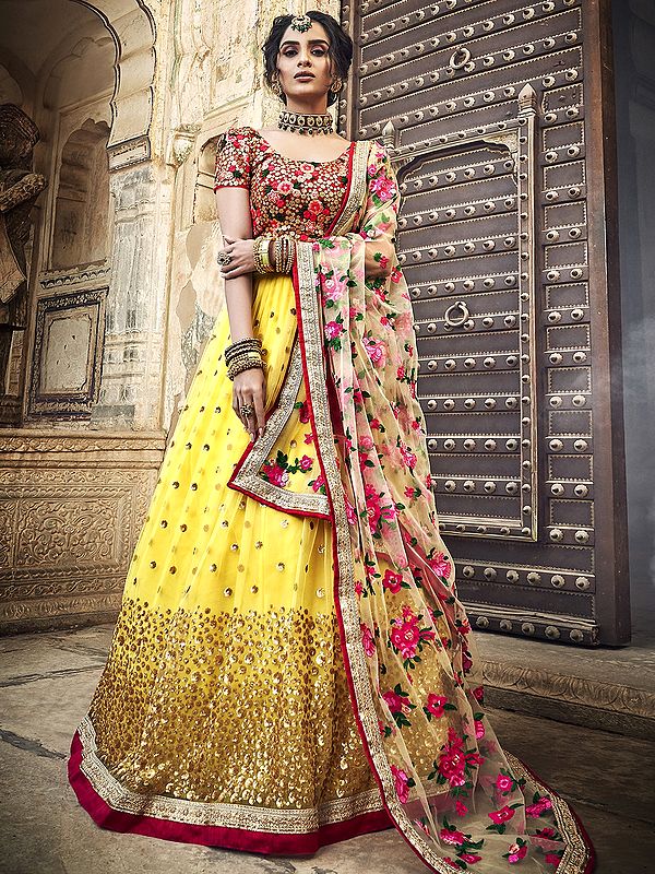 Yellow Soft Net Chakra Sequin Motif Lehenga with Thread, Zari Work and Floral Embroidered Red Choli