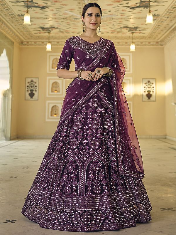 Wine Soft Net Mughal-Chowkadi Motif Lehenga Choli With All-Over Dori-Mirror Embroidery And Dupatta